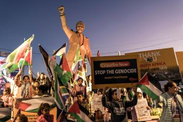 Palestinians gather around a statue of Nelson Mandela after South Africa files a landmark case against Israel at the International Court of Justice, Ramallah, Jan. 10, 2024.