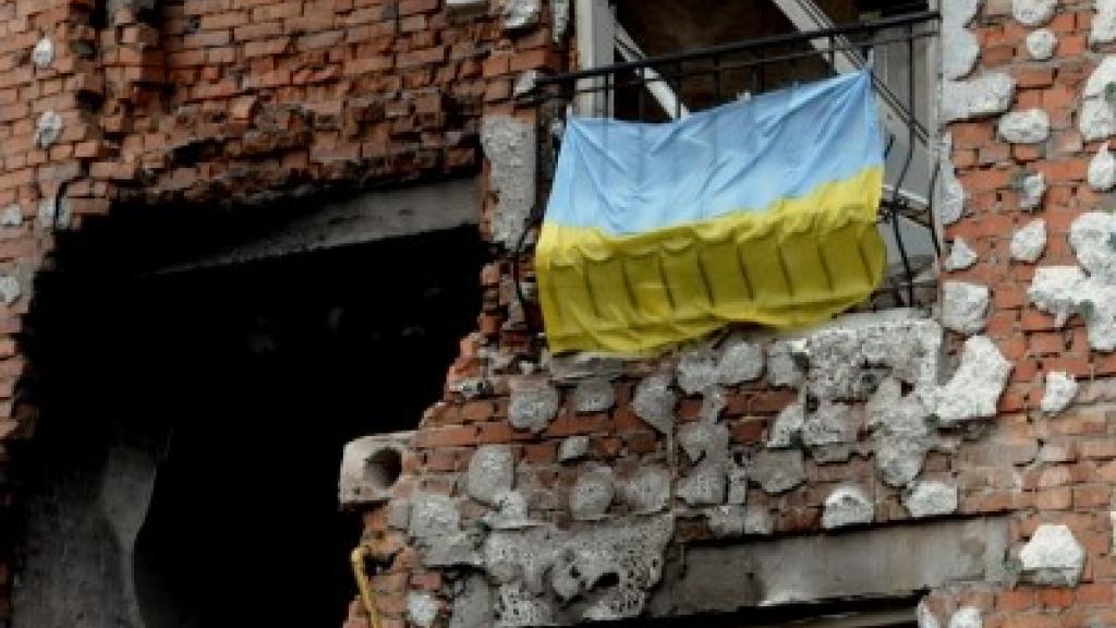 Ukraine flag bombed building