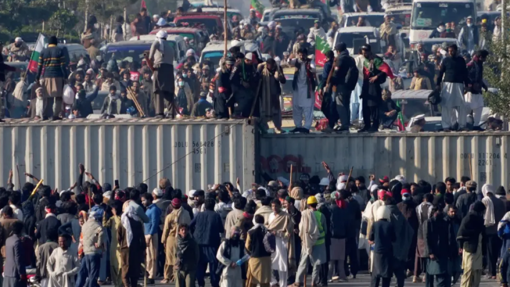 Imran Khan’s supporters broke through security barriers on roads blocked with shipping containers as they responded to his call for a sit-in protest. 