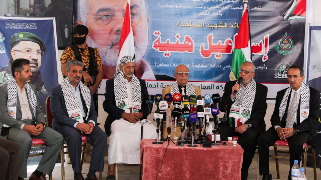Head of the Houthi-led government Ahmad al-Rahawi (3rd from right) and members of his government listen to the representative of Hamas in Yemen, Muadh Abu Shammalah, during their visit to the Hamas office in Sanaa, Yemen on August 19, 2024.