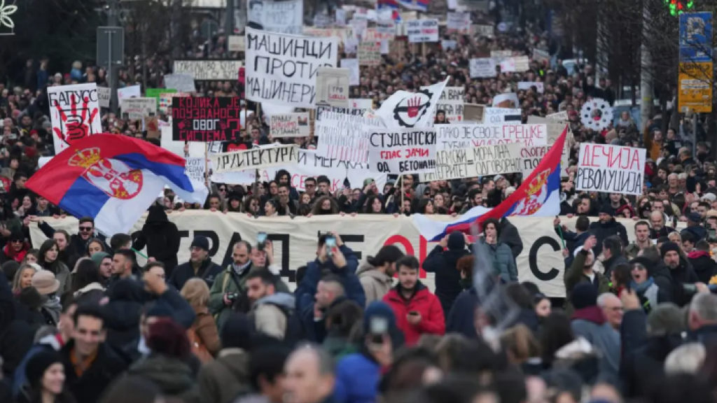 People attend a protest against the Serbian authorities, demanding justice for the victims of the train station roof collapse in Belgrade.