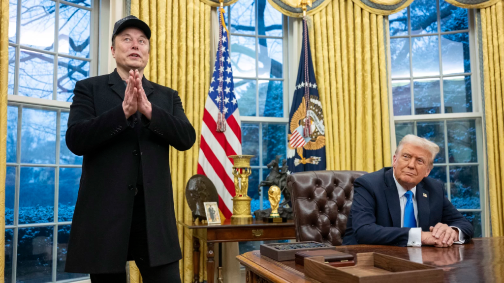 Elon Musk takes questions from reporters as President Trump looks on in the Oval Office of the White House on Tuesday.