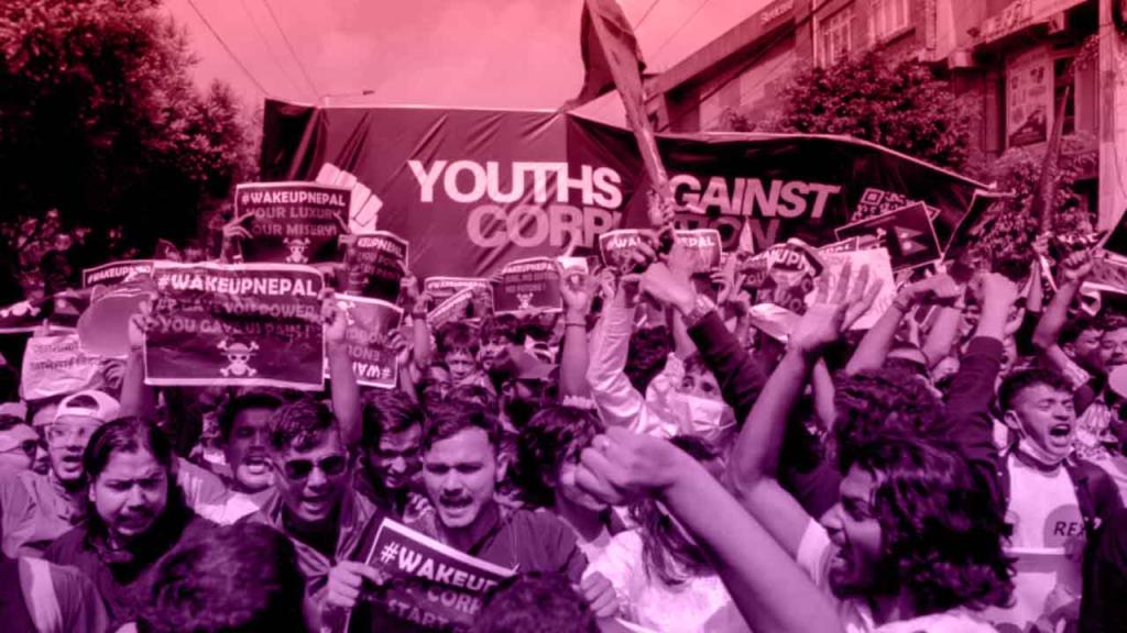 Youth in Nepal hold posters demanding an end to corruption during the Gen Z protests.