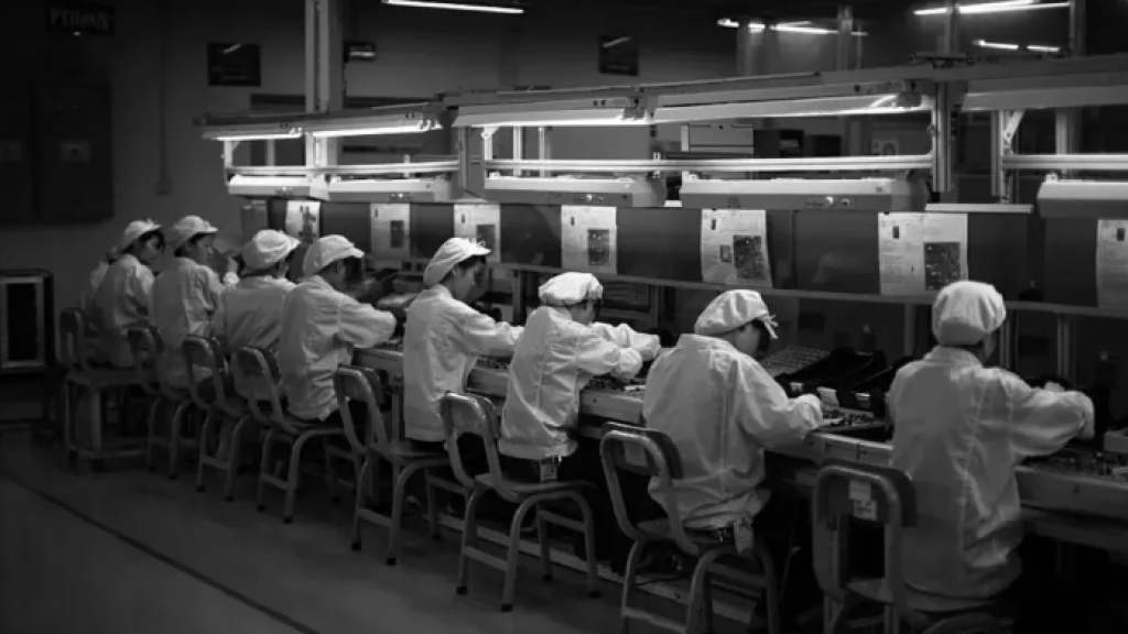 Chinese workers labour production line
