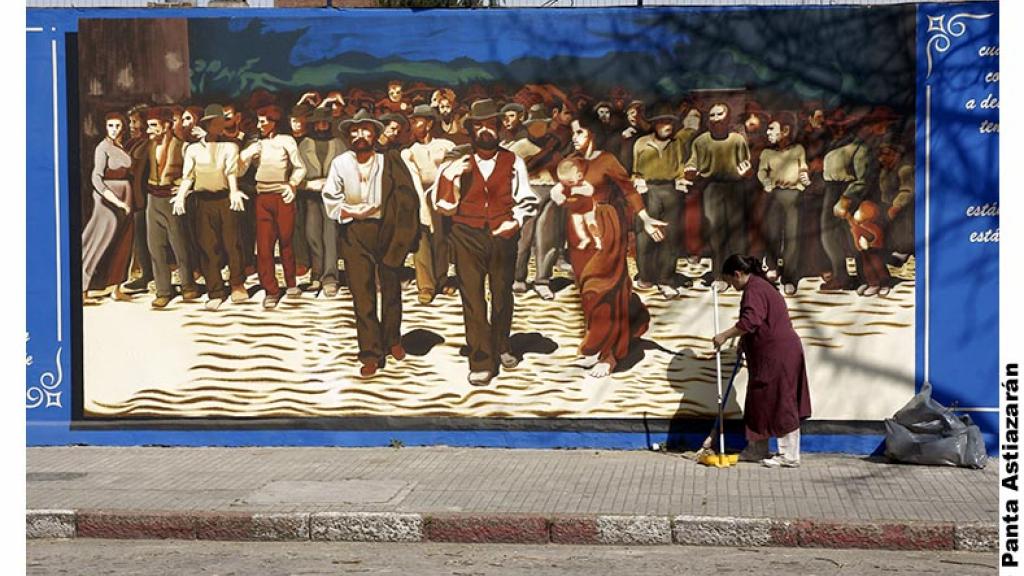 sweeper in front of mural
