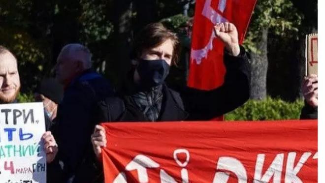 Protestor holding banner