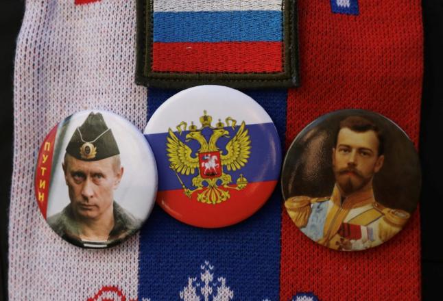 Badges of Putin and Tsar Nicholas