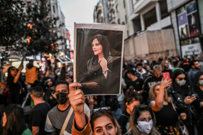 A protester holds a portrait of Mahsa Amini during a demonstration in support of Mahsa Aminiin Tehran on September 22.