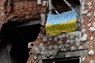 Ukraine flag bombed building