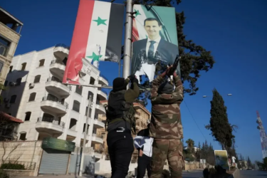 Taking down Assad Syria flag