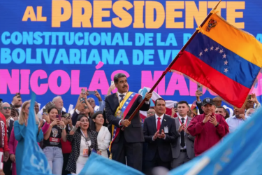 Venezuelan president Nicolas Maduro waves his nation’s flag at Miraflores Palace during his third-term inauguration in Caracas.