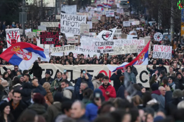 People attend a protest against the Serbian authorities, demanding justice for the victims of the train station roof collapse in Belgrade.