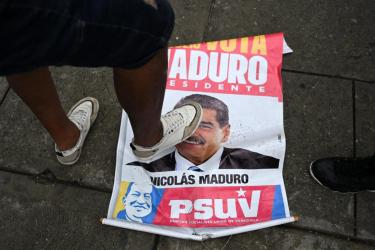 An opponent of Venezuelan President Nicolás Maduro’s government steps on an election campaign poster with the image of Maduro during a protest at the Petare neighborhood in Caracas on July 29, 2024, a day after the Venezuelan presidential election.