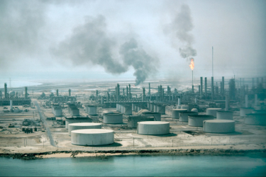The Aramco oil refinery in Dhahran, Saudi Arabia. COP30 offered no fossil-fuel phase-out; oil-producing nations blocked binding language, and the final deal focused on voluntary road maps instead.