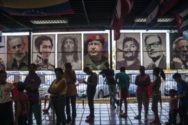 "The gallery of the revolution" at a bar in the 23 de Enero neighborhood of Caracas. Left to right: Fidel Castro, Simón Bolívar, Jesus Christ, Hugo Chávez, Che Guevara, Salvador Allende, Néstor Kirchner. (Eneas De Troya / CC BY 2.0)
