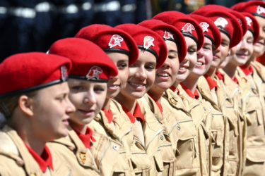 Russian women cadets march past the review stand during the annual Victory Day military parade through Red Square