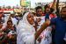 A Sudanese woman chants slogans during a demonstration demanding a civilian body to lead the transition to democracy, outside the army headquarters in Khartoum on April 12, 2019. 